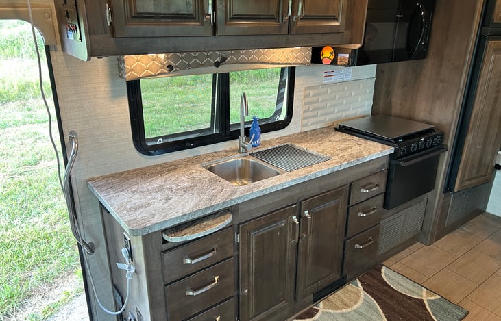 Main Space - Sink, Stove, & Cabinets