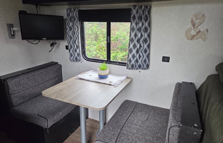 The dinette converts to another bed and tv/dvd is on a swivel. Dvds included!