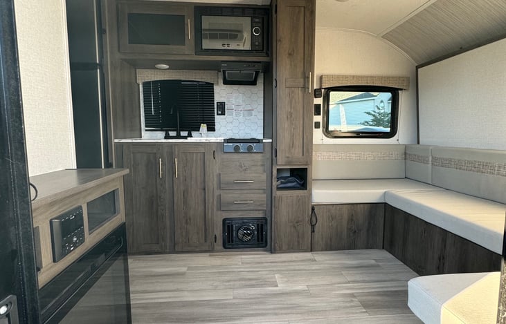 The lounge area is a flexible living space that can be converted to a dining area or the main sleeping space with a murphy bed.

There is an electric fire place that makes this area feel very cozy!