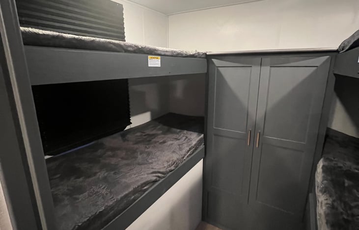 Bunk room with a lot of storage