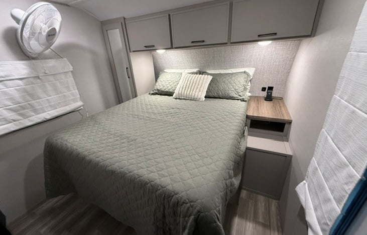 Master Bedroom. Full Queen size bed with 12" cool gel memory foam mattress. His/Her Phone Chargers. Oscillating Fan.