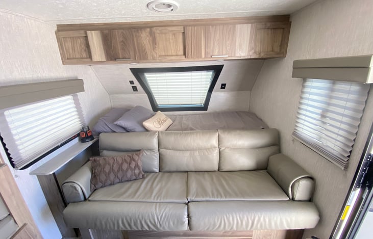 Sofa sits 3-4 people and has storage area below and on top.