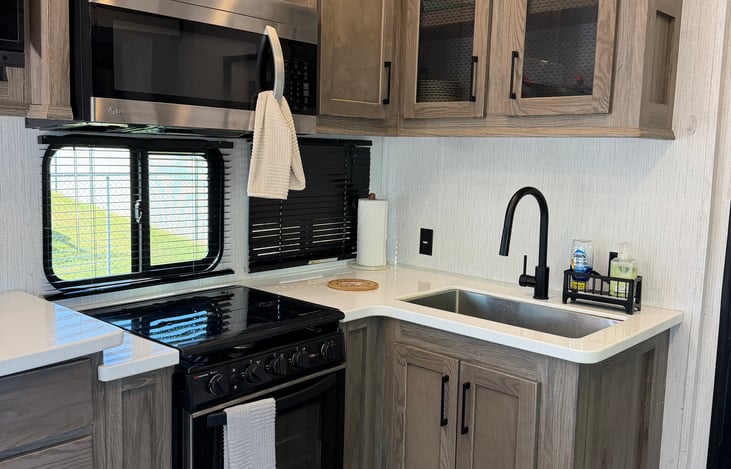 Cook, gather, and unwind! Enjoy a fully stocked kitchen, plenty of cabinet space, and a cozy fireplace for relaxing evenings.