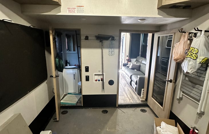 Garage area with a half bath.