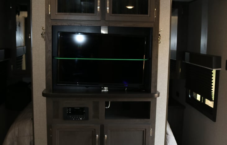 Entertainment center with DVD, CD, AM/FM, TV and all the movies!