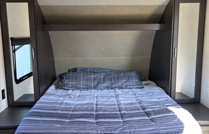 Queen size bed with linens