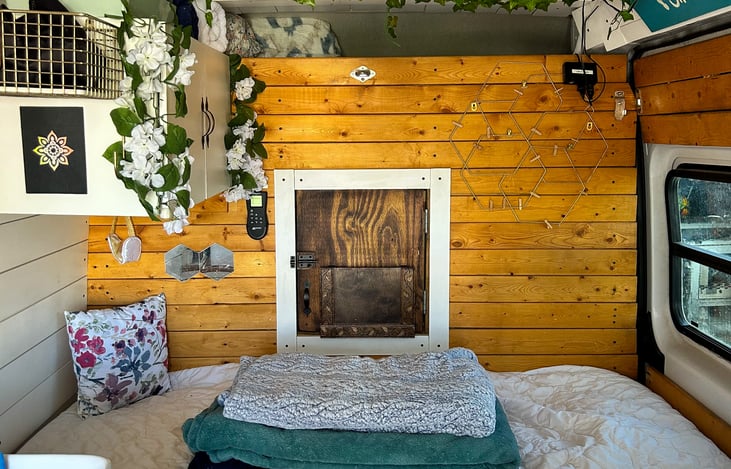 This is the bed converted to a full size bed. To the right, you can see the closed sliding door and that middle door leads to the cockpit.