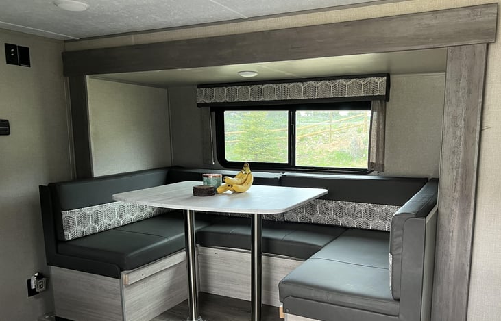 Big slide out with great seating around the table and an incredible amount of storage under the seating areas. Big window to allow a lot of light.