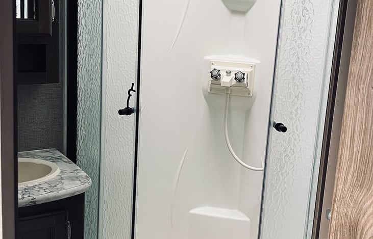 Shower stall with removable shower head.