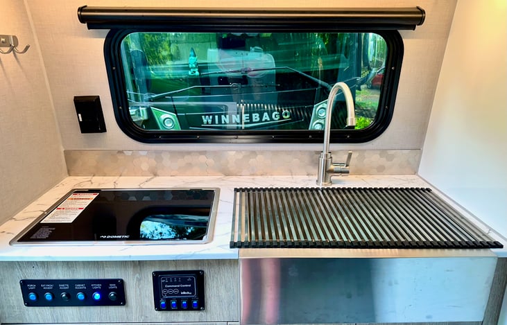 Great view of the woods while cooking or cleaning up.
