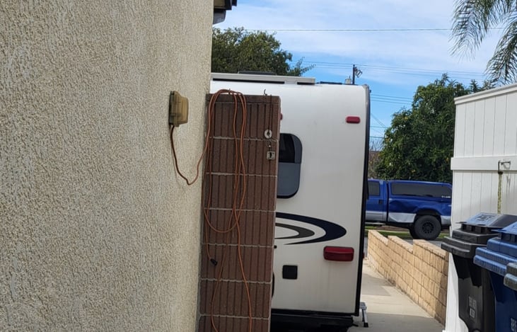 Staionary rental access gate to owner's backyard and patio.