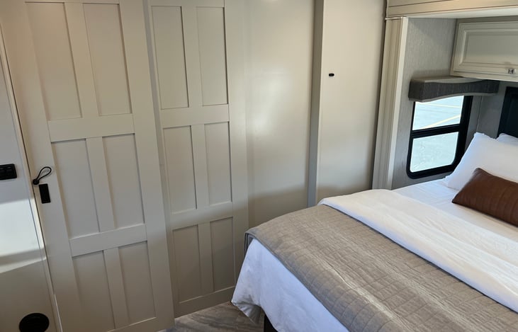 Doors that separate the master bedroom from the rest of the coach. Sometimes you just need to separate yourself from the rest of the crew, you know?