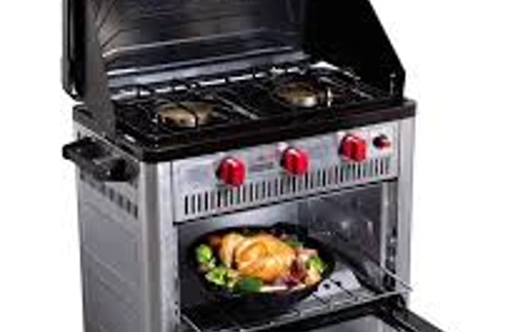 Add on for additional fee of $15/day.  Camp Chef OUTDOOR CAMP OVEN, propane fueled oven and 2 burner stove. Bake and cook on your picnic table.