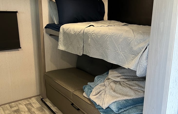 Bottom couch folds out into a full bed size.