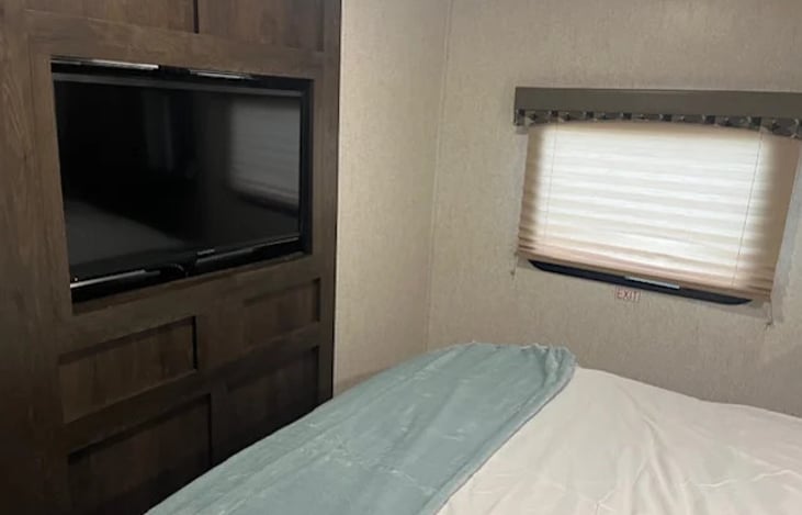 TV swivels from living to master.