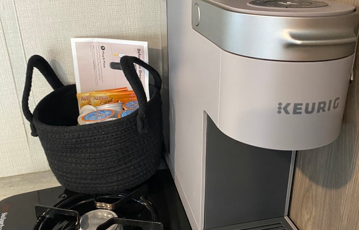 Keurig with coffee and creamers