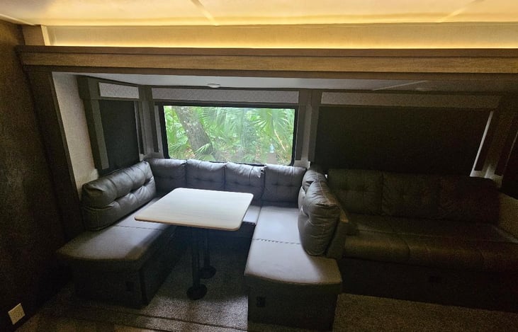 Dining room seating and living room seating area.