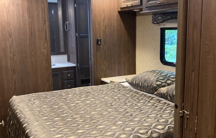 Master bed into bathroom