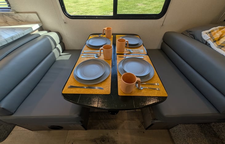 Cozy dinette converts to a bed as well. Plenty of natural light throughout.