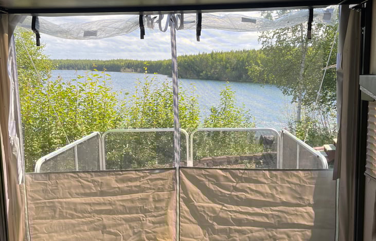 ramp down with railing for a back porch.  screen or solid clear widow cloth options.