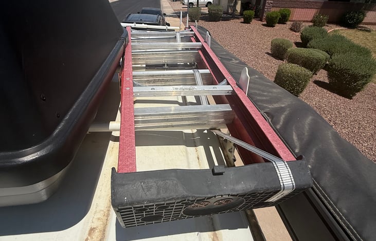 Gypsy Wagon top vow of ladder and roof bin storage.