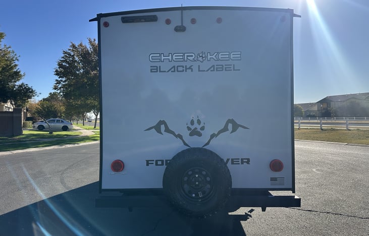 Rear exterior with spare tire and Cherokee Black Label rear cap.