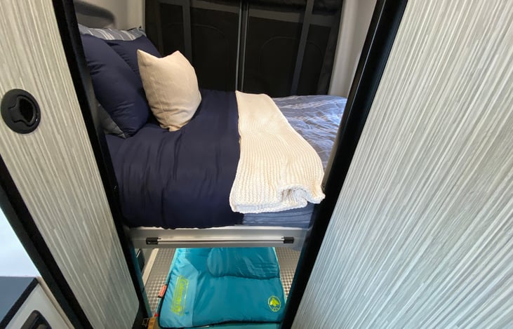 Sleeping arrangements for two adults and one child. Child mattress is 5 feet long.