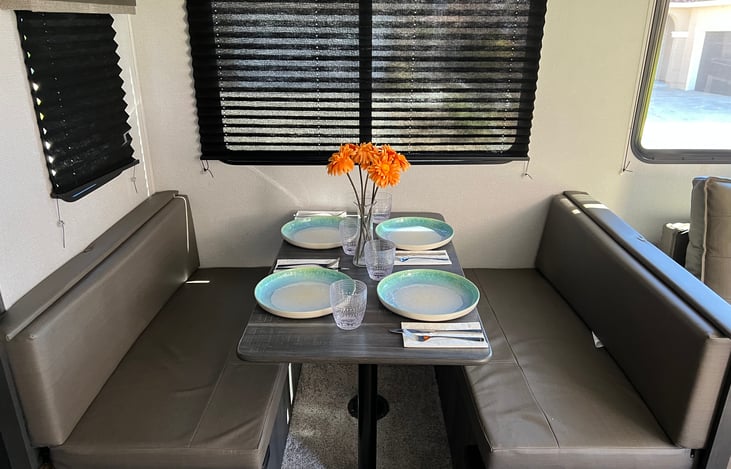 Dining table also is a short double/oversized twin bed. 2 large compartments under benches perfect for your luggage!