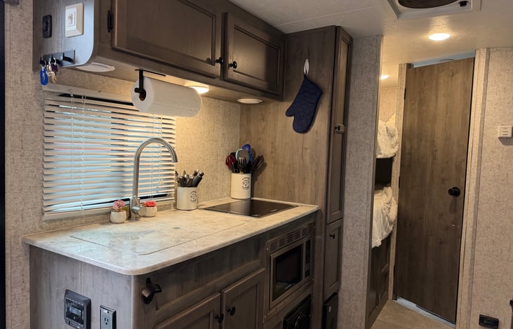 Kitchen with sink and stove closed up.