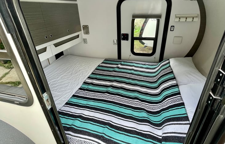 Comfortable queen size bed! Comes as shown, linens available as an add-on option.