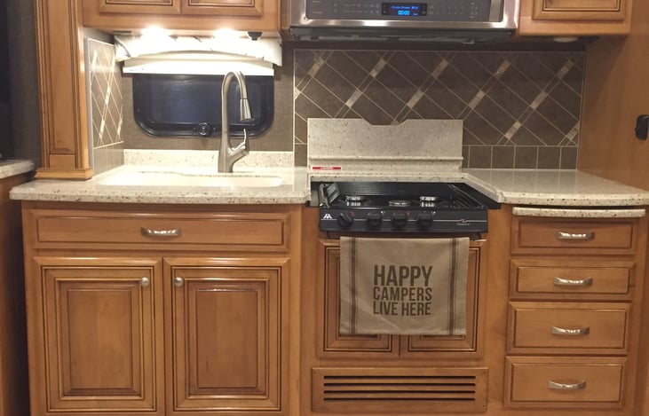 Kitchen with 3 burner propane stove and convection microwave oven