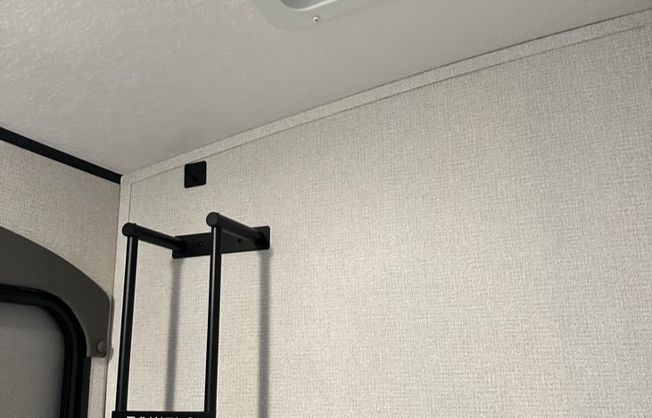 Area for towel storage and bathroom vent.