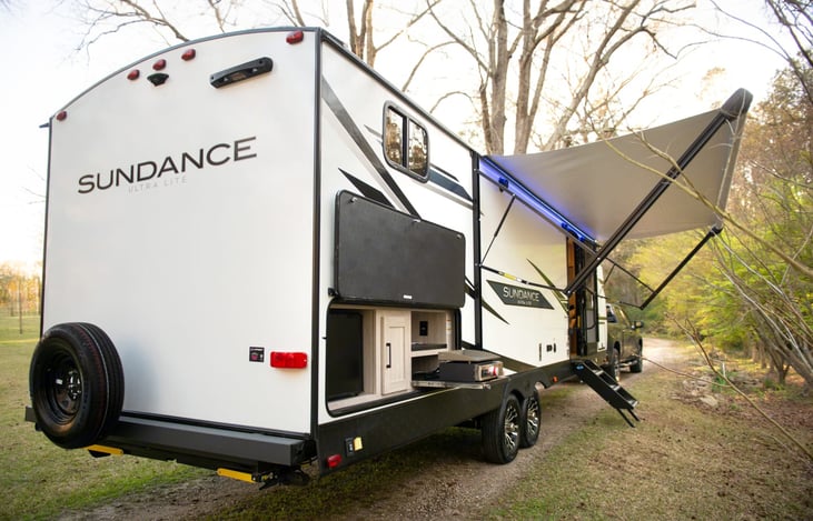 This Sundance Ultra Lite is designed with your whole crew in mind. Sleeps up to 10. Spacious and accommodating. Large slide out and awning. Indoor and outdoor speakers. Outdoor kitchen and more.