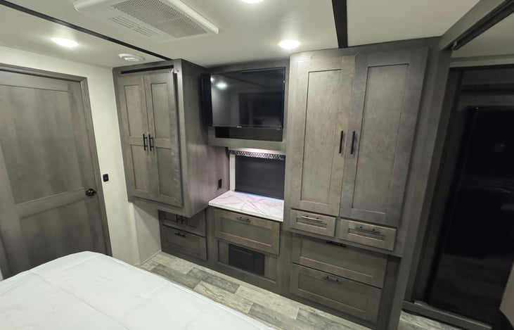 Wardrobe, storage and TV in the Master Suite.