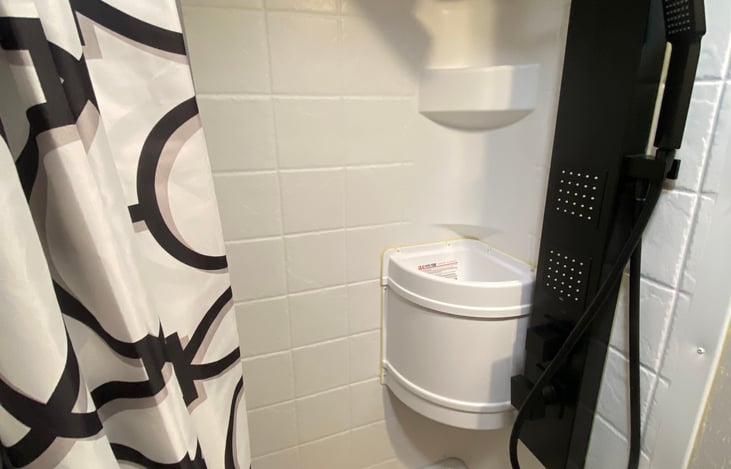 With luxurious shower head.