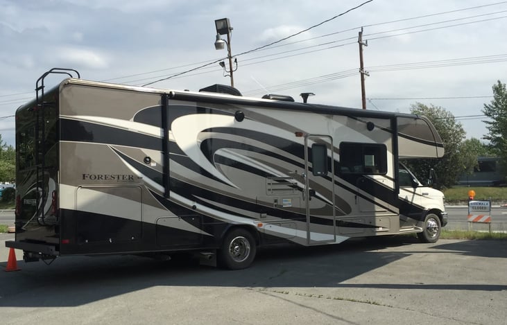 Right side of Rv, awning, exterior tv