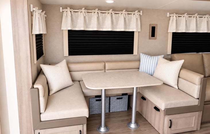 Spacious booth-style dinette — perfect for family meals, games, or relaxing together.