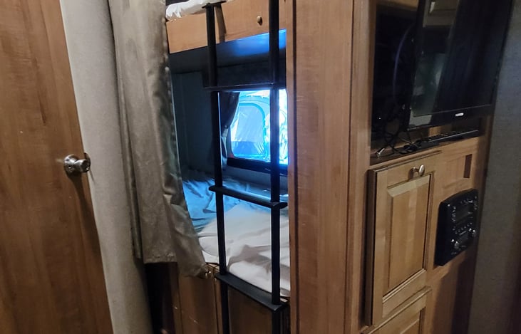 Bunk beds. TV with firestick, DVD player, radio etc. Inside and outside speakers.