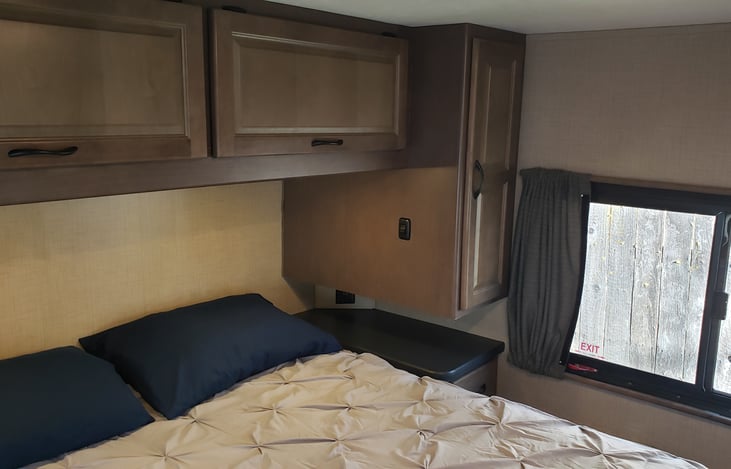 Rear Bedroom, storage, and counter to charge phones.