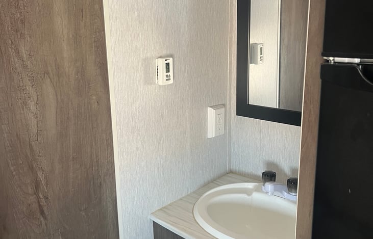 Sink and medicine cabinet.