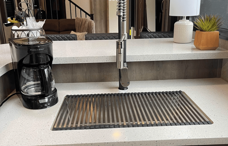 Expandable sink cover/drain and pull down faucet.  Updated coffee maker to a Keurig.