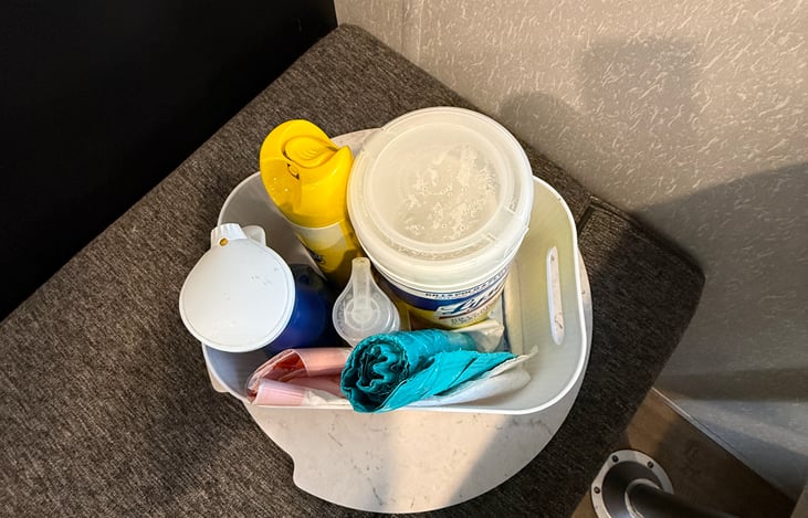 Cleaning supplies, with soap and extra trash bags.