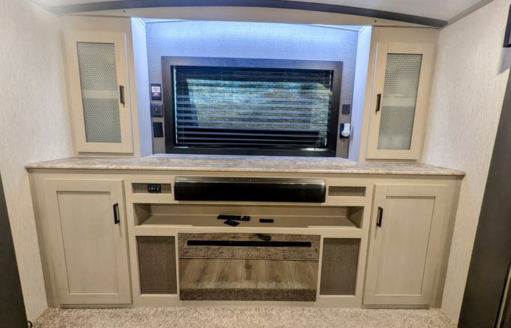 Front living room with electric fireplace and televator.