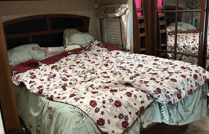 Main bedroom has queen size bed, walk around on both sides.