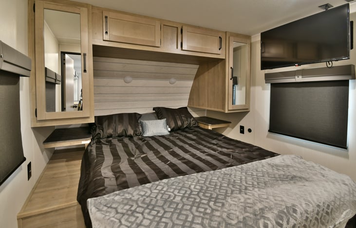 Queen size bedroom with TV and own AC unit.