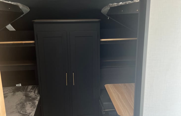 2nd bedroom with 3 bunk beds and a table with 2 seats that convert to the 4th bunk or just use as a table.