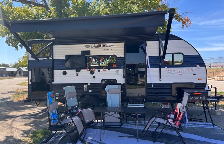 All included camping gear: 4 chairs, 22-inch Blackstone griddle, outside rug, outside table and mount inside TV on outside mount.