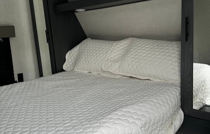 Master Queen bed with a memory foam topper