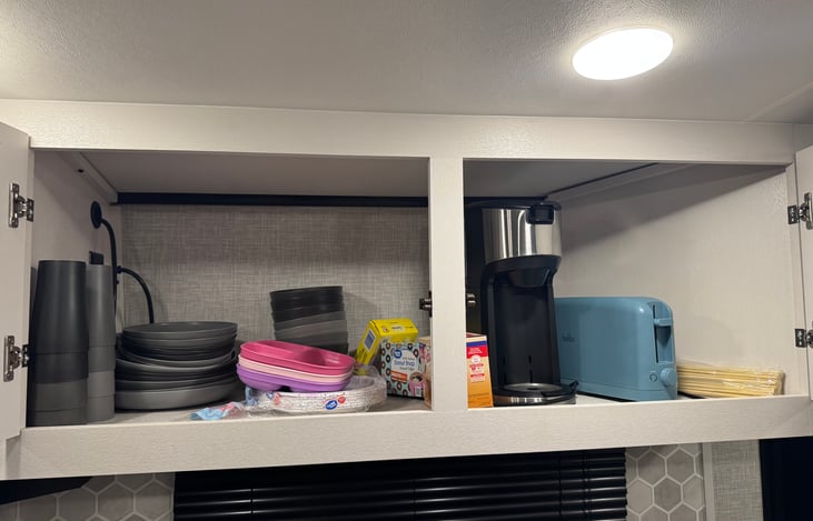 Small and large plates, bowls, cups, kids plates, coffee mugs, coffee maker, toaster and s’more sticks