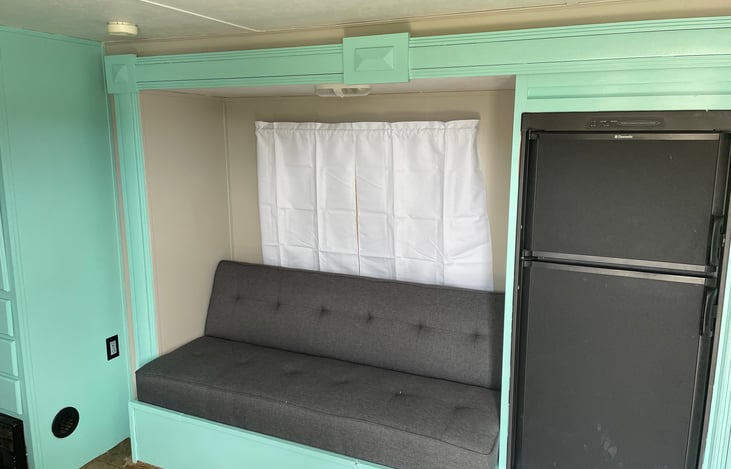 Couch folds down into futon style bed